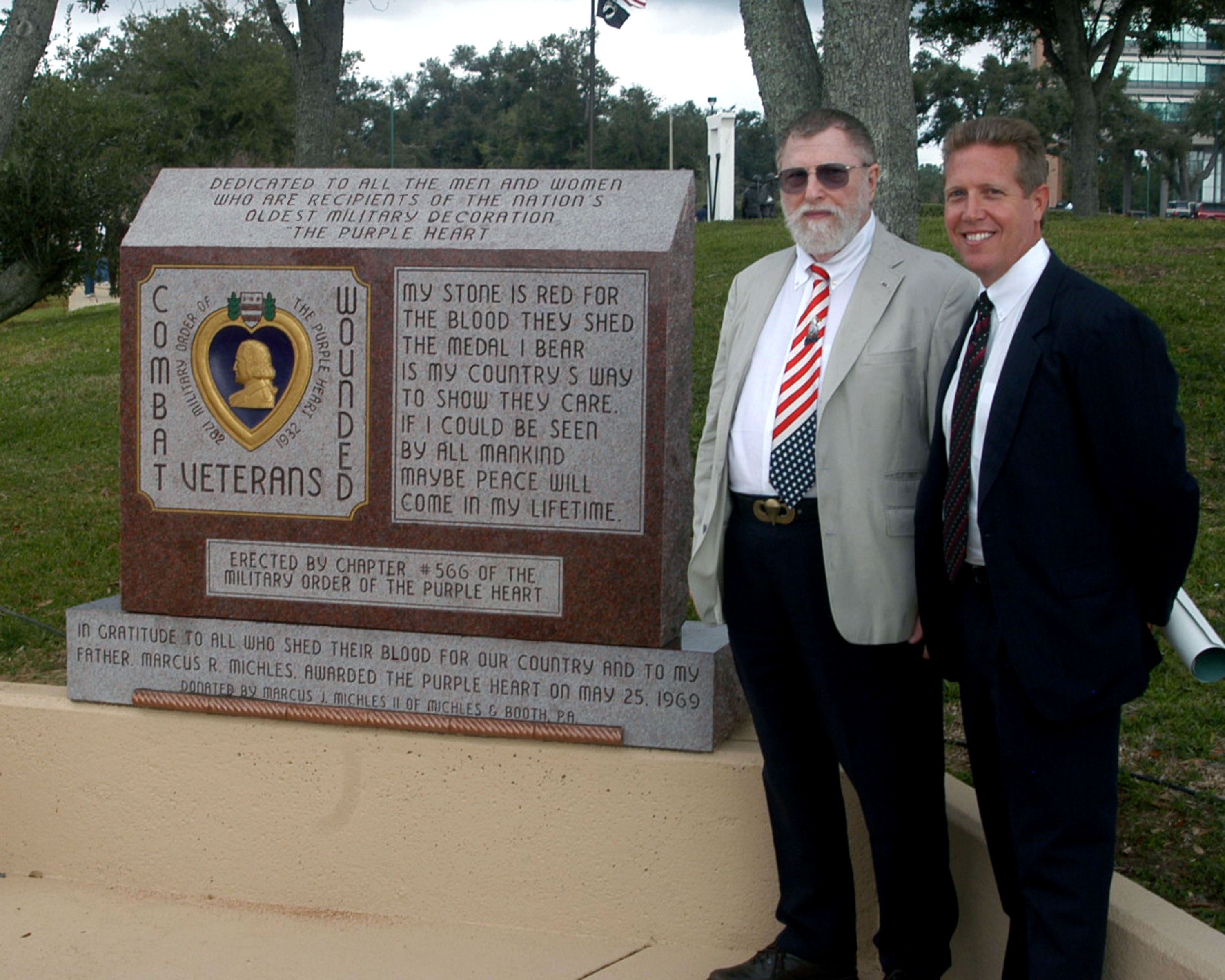 Marcus J. Michels and his father at the purple heart memorial